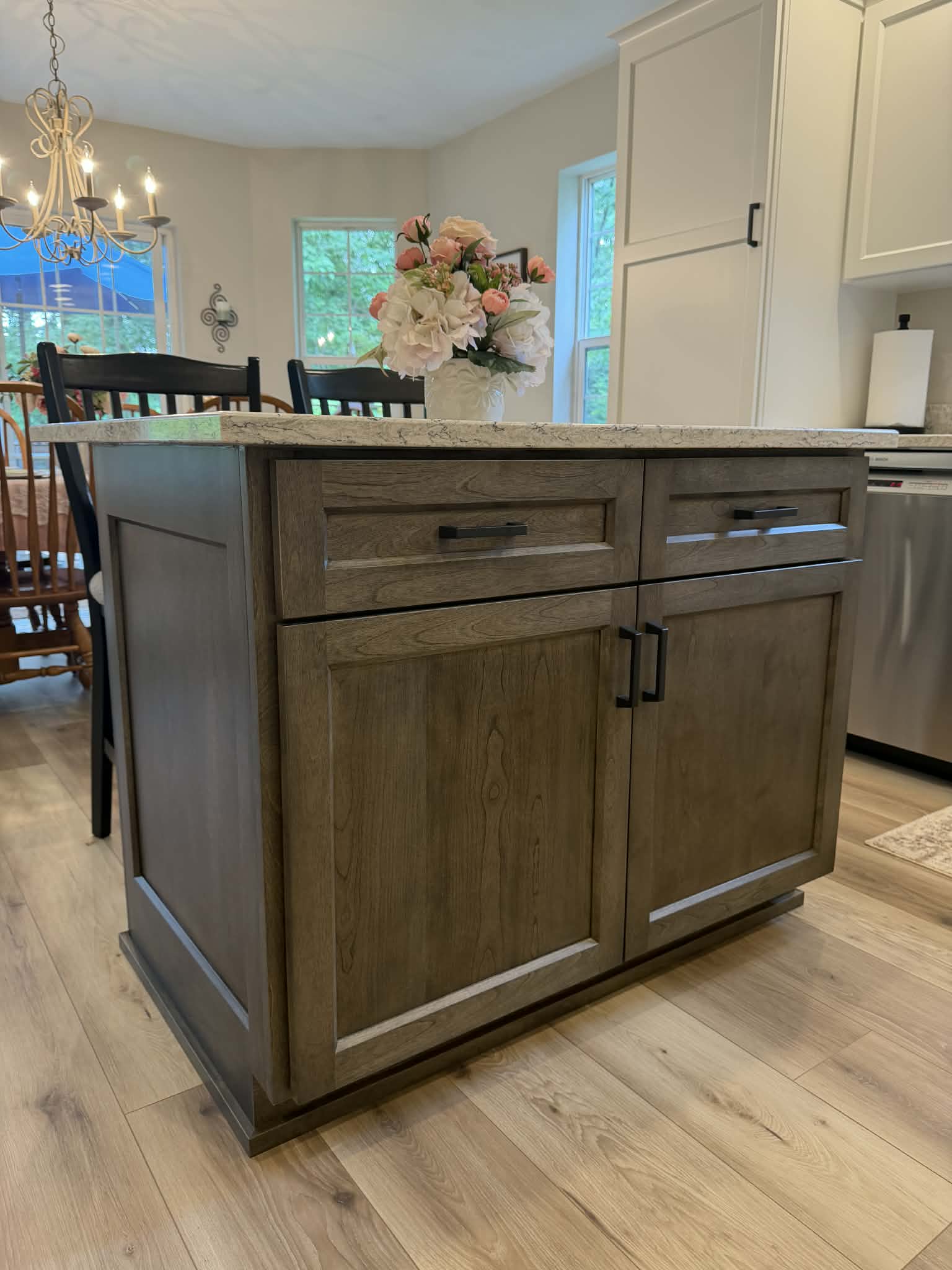 Custom stained kitchen island with granite countertop